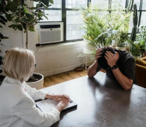 Man taking advice from doctor